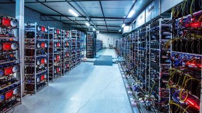 A modern mining farm with rows of powerful mining machines